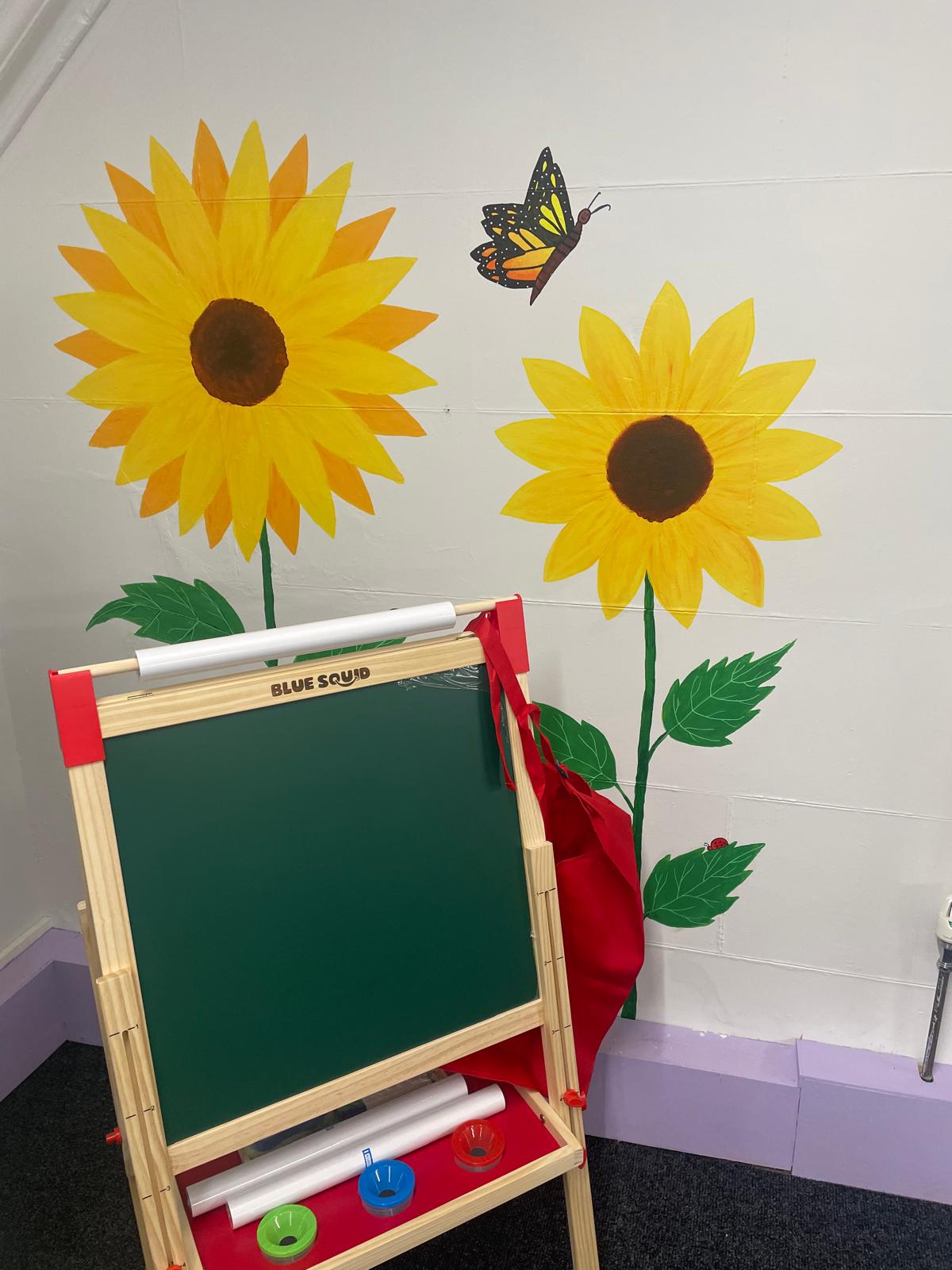 Specialist staff working with children in a bright, engaging classroom